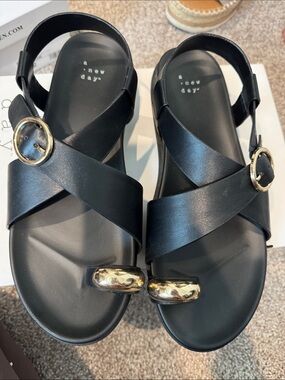 a new day Black Cross-Strap Sandals with Gold Accents
